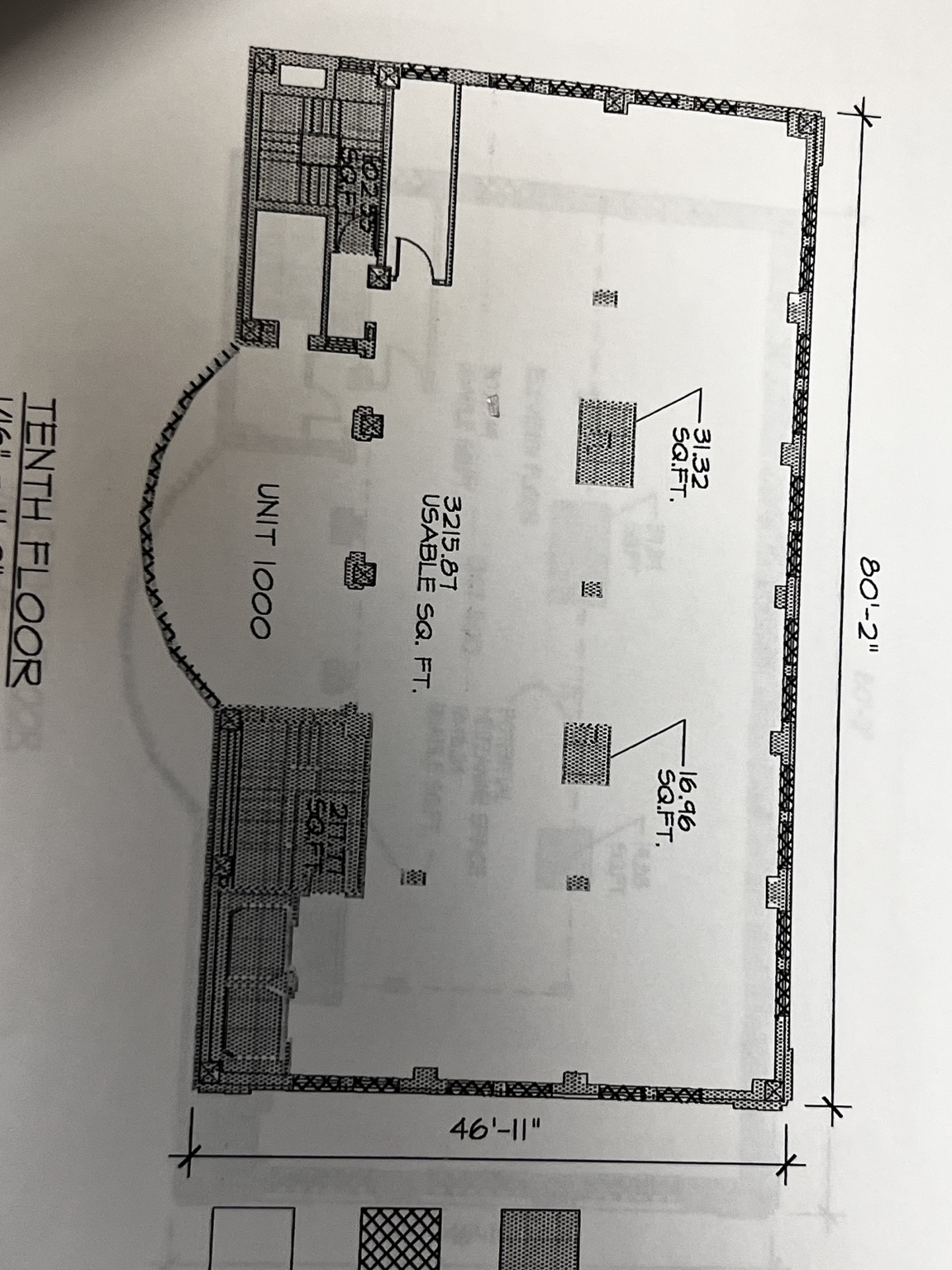 Original tenth-floor drawing labeled Unit 1000, showing the perimeter, columns, dimensions, and elevator and stair cores